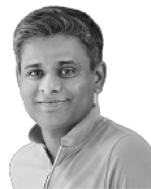 Black and white photo of Arsalan Ali, he is smiling, has short hair and is wearing a collared polo top