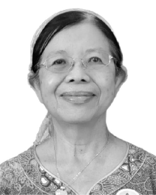 Black and white photo of Chang-Tang Siew Ngoh, she is smiling, has her hair tied back and wears glasses